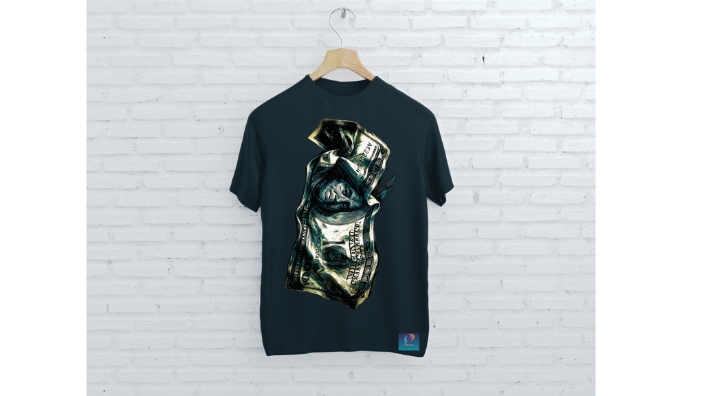 Black t-shirt with a graphic design on a hanger against a white brick wall.